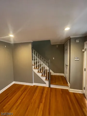 a view of a livingroom with wooden floor