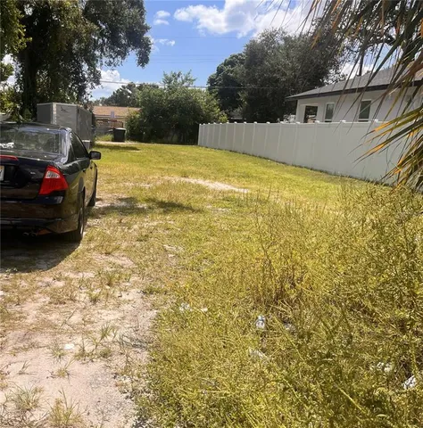a view of a swimming pool with a yard