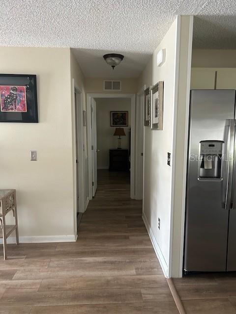 9748 Southwest 97th Street Ocala, FL 34481 - Photo 6 of 16 a view of a hallway view with wooden floor and staircase