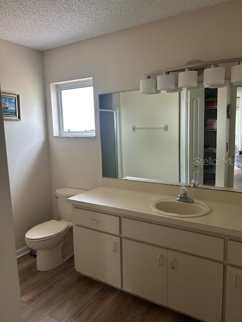 9748 Southwest 97th Street Ocala, FL 34481 - Photo 9 of 16 a bathroom with a sink toilet and shower