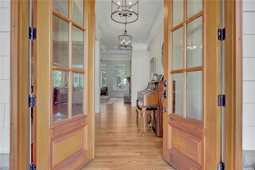 25 Paragon Point Newnan, GA 30265 - Photo 3 of 127 a view of a hallway with wooden floor and staircase