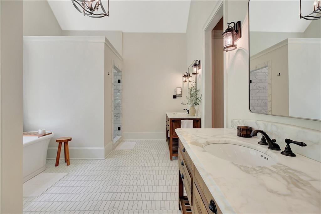 25 Paragon Point Newnan, GA 30265 - Photo 32 of 127 a spacious bathroom with a tub sink and mirror