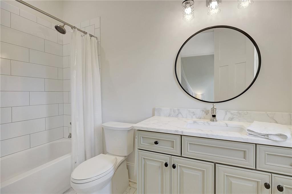 25 Paragon Point Newnan, GA 30265 - Photo 56 of 127 a bathroom with a sink a toilet and a mirror