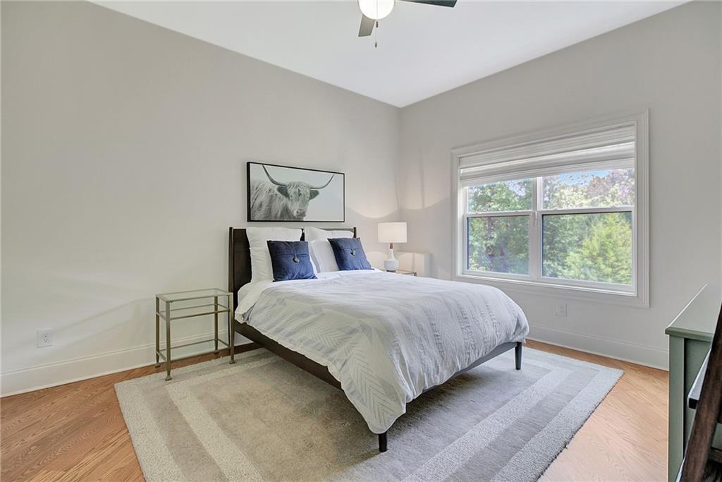 25 Paragon Point Newnan, GA 30265 - Photo 76 of 127 a bedroom with a bed and a window