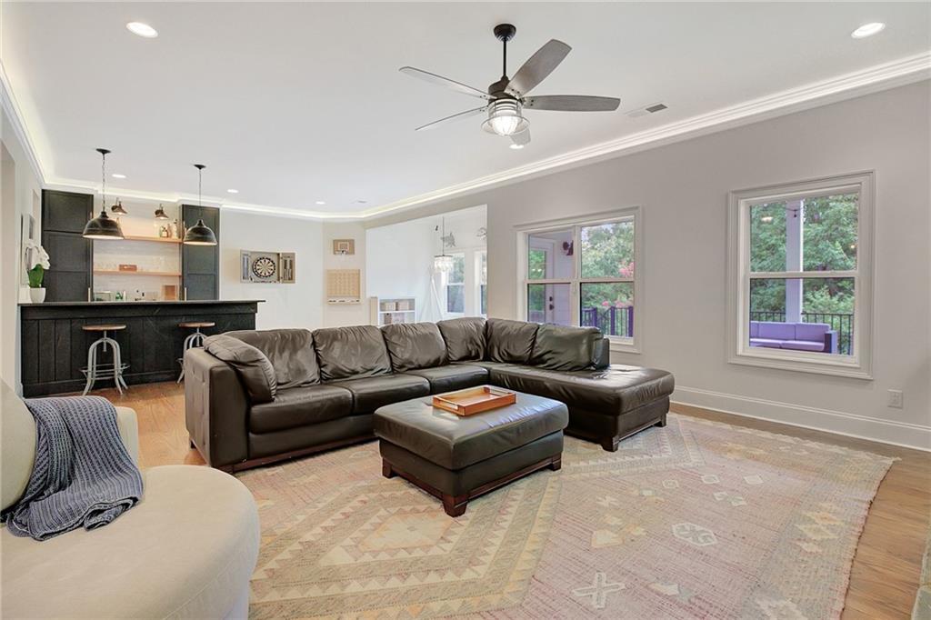 25 Paragon Point Newnan, GA 30265 - Photo 79 of 127 a living room with furniture ceiling fan and a window