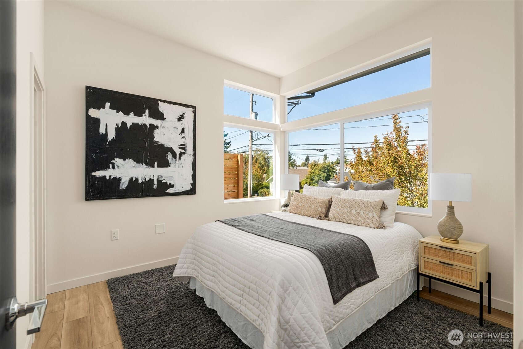 4853 South Findlay Street Seattle, WA 98118 - Photo 13 of 32 a bedroom with a large bed and a window