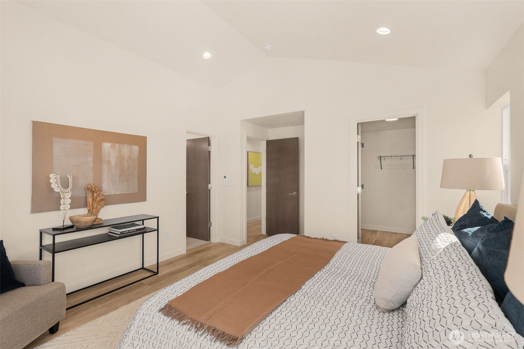 4853 South Findlay Street Seattle, WA 98118 - Photo 14 of 32 a bedroom with a bed and wooden floor