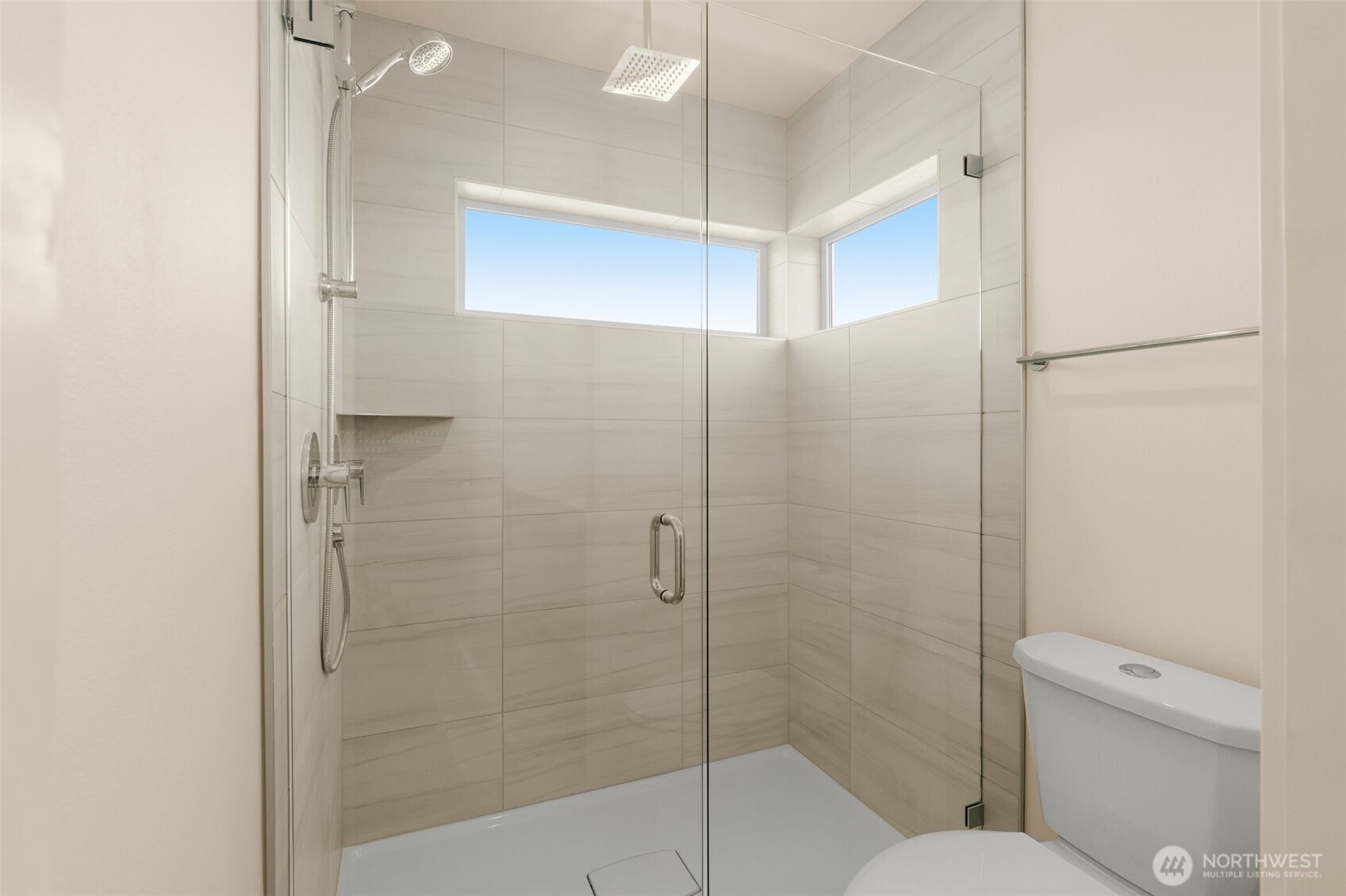 4853 South Findlay Street Seattle, WA 98118 - Photo 18 of 32 a bathroom with a shower a toilet and a sink