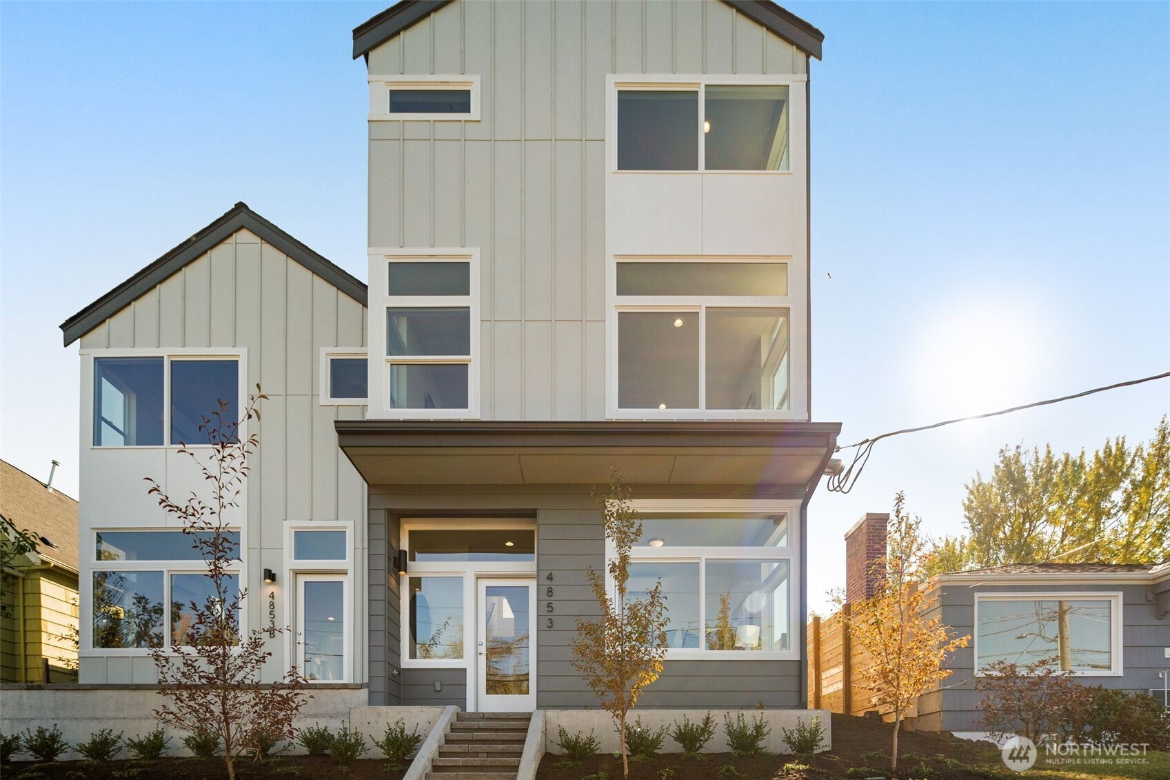 4853 South Findlay Street Seattle, WA 98118 - Photo 2 of 32 front view of a house with a yard