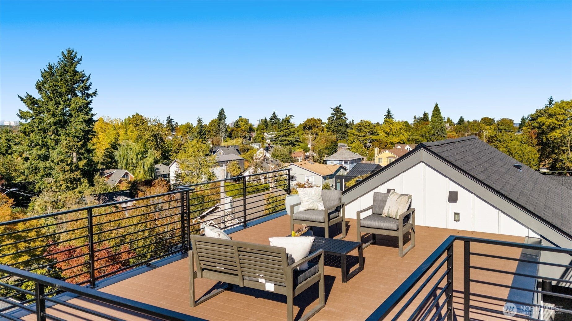 4853 South Findlay Street Seattle, WA 98118 - Photo 25 of 32 a view of a roof deck with couches and wooden floor