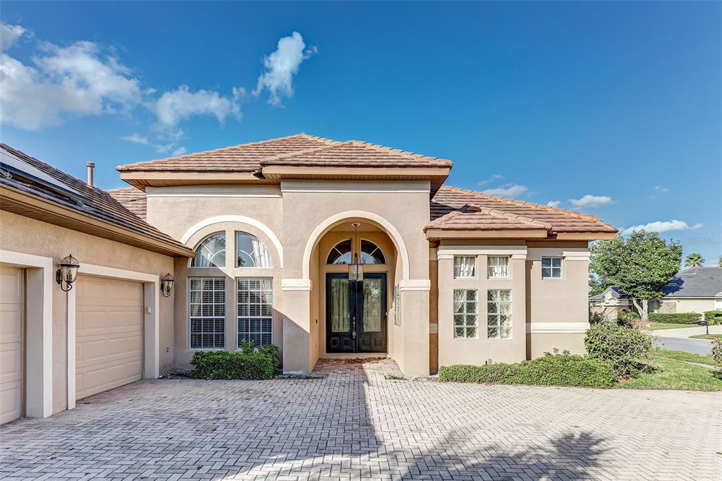 918 Algare Loop Windermere, FL 34786 - Photo 44 of 73 a front view of a house with garden