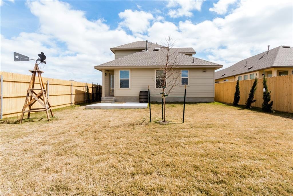 2104 Pindos Pony Way Georgetown, TX 78626 - Photo 27 of 30 A spacious backyard with privacy fencing, an outdoor patio, and room for a garden.