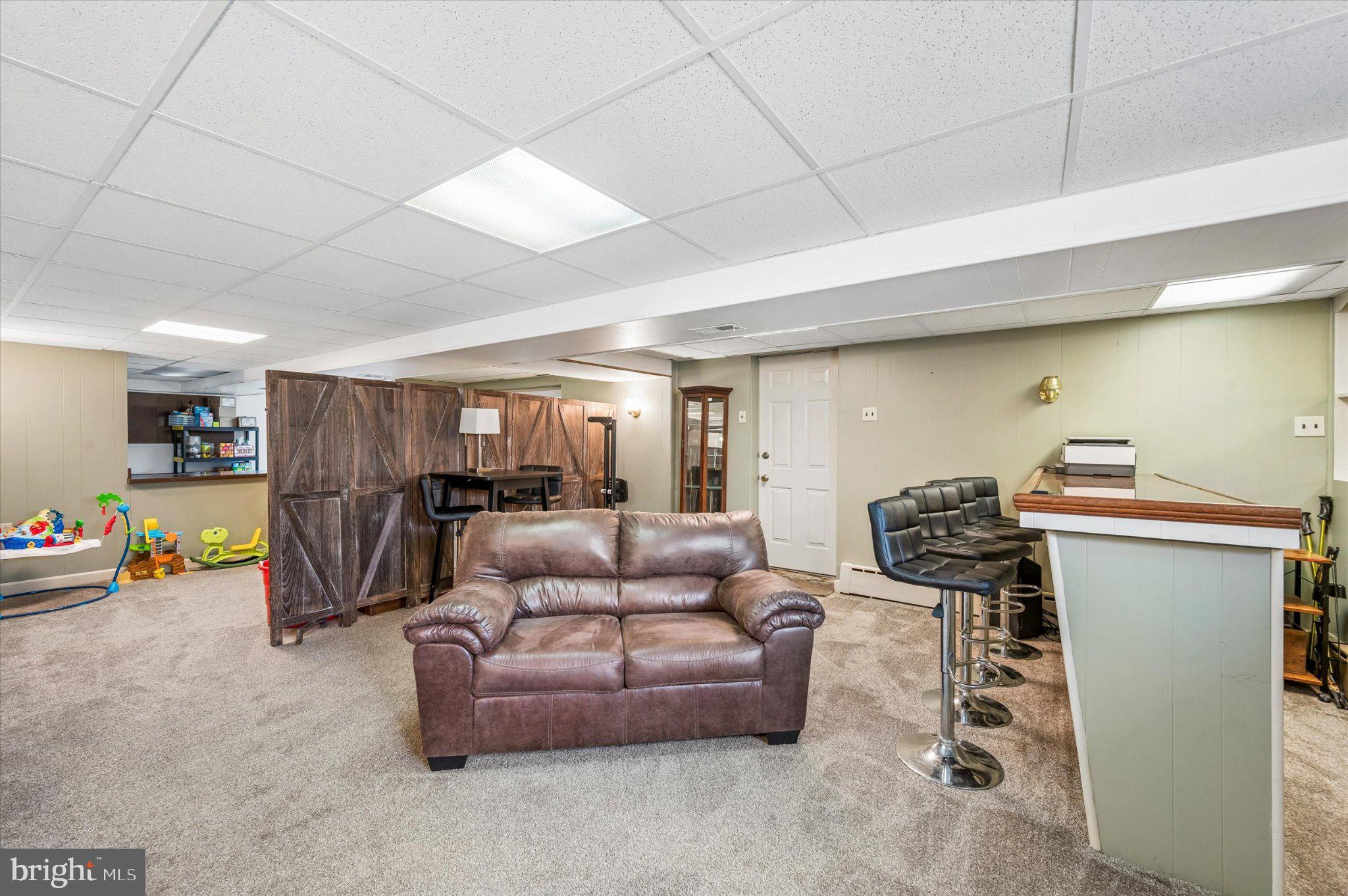 82 Hoffman Road Ridley Park, PA 19078 - Photo 19 of 25 Spacious basement retreat for relaxation.