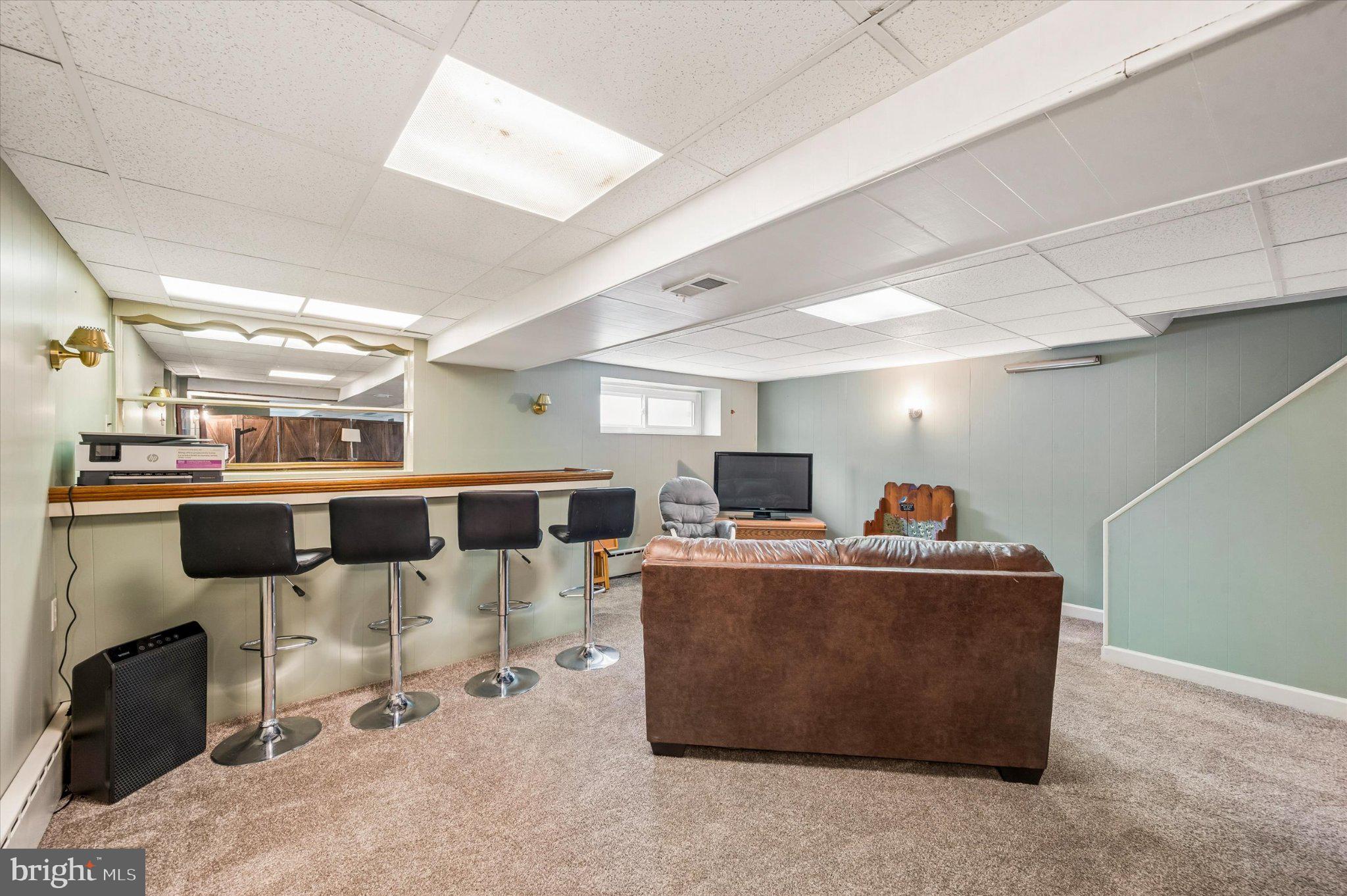 82 Hoffman Road Ridley Park, PA 19078 - Photo 20 of 25 Cozy basement retreat with modern flair.