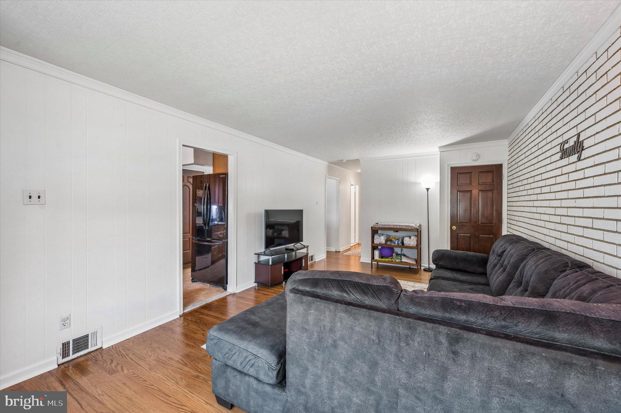 82 Hoffman Road Ridley Park, PA 19078 - Photo 7 of 25 Spacious living area with modern charm.
