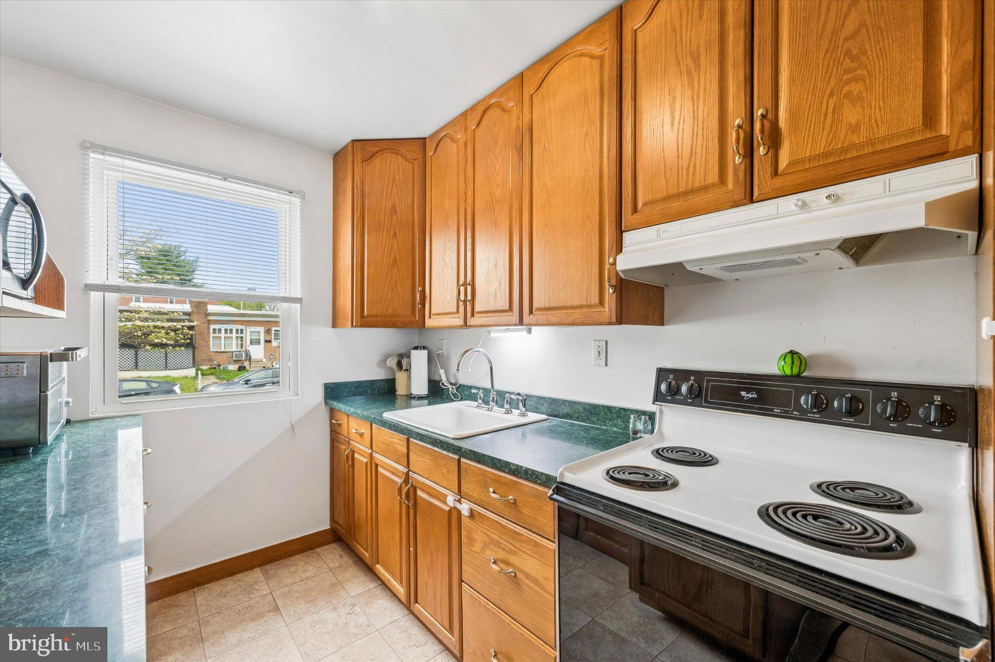 82 Hoffman Road Ridley Park, PA 19078 - Photo 9 of 25 Cozy kitchen with warm wood accents.