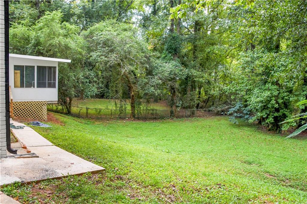 3530 Turner Heights Drive Decatur, GA 30032 - Photo 5 of 22 a view of a backyard with table and chairs and potted plants