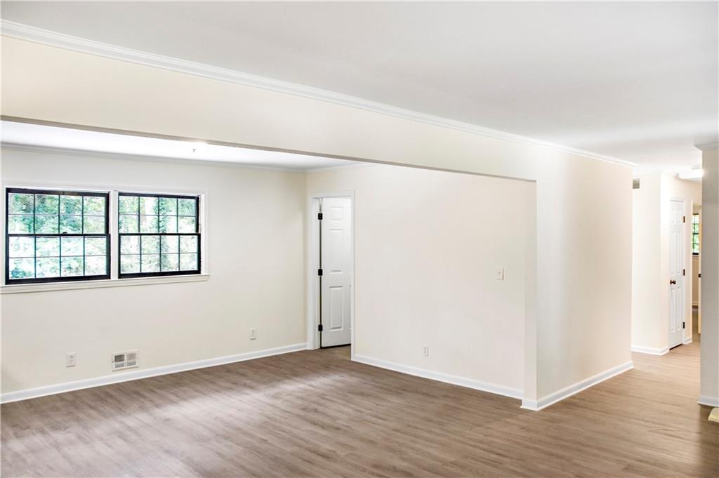 3530 Turner Heights Drive Decatur, GA 30032 - Photo 8 of 22 an empty room with wooden floor and windows