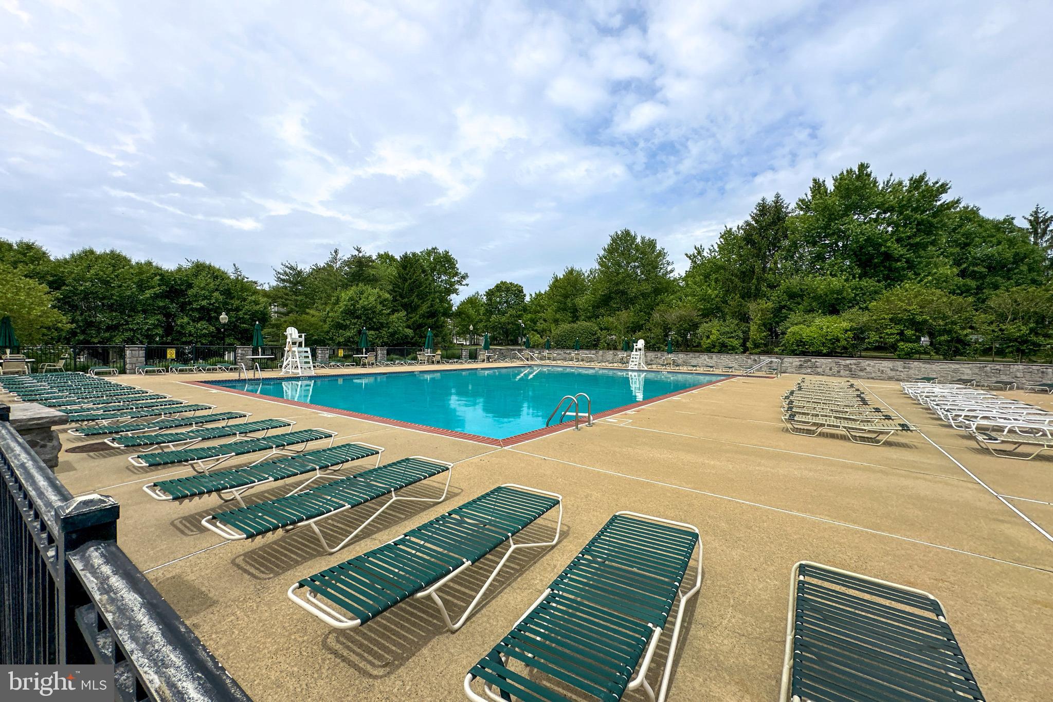 24 Foster Road Pennington, NJ 08534 - Photo 30 of 38 a view of a swimming pool with a patio