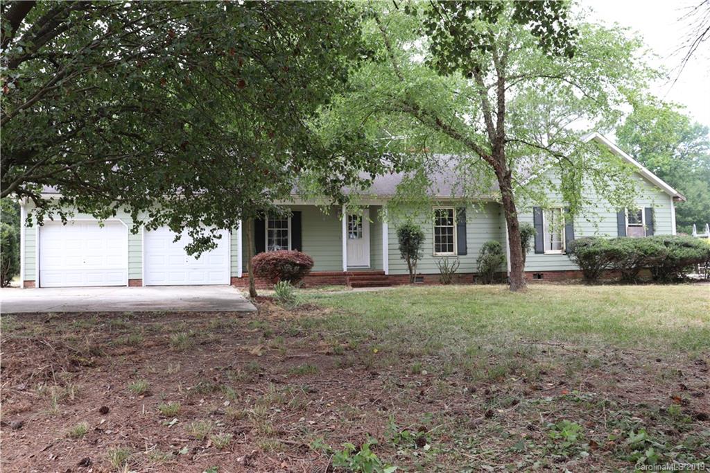 6520 Medlin Road Monroe, NC 28112 - Photo 1 of 22 a view of a house with backyard and trees