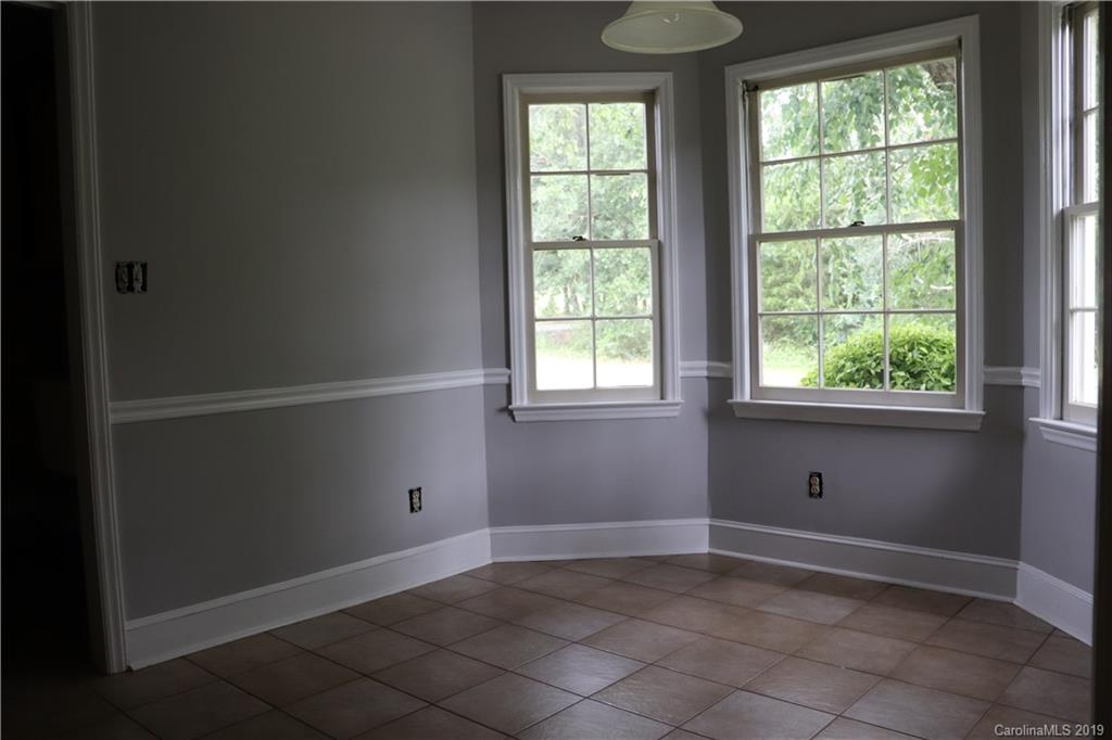 6520 Medlin Road Monroe, NC 28112 - Photo 13 of 22 a view of an empty room with a window