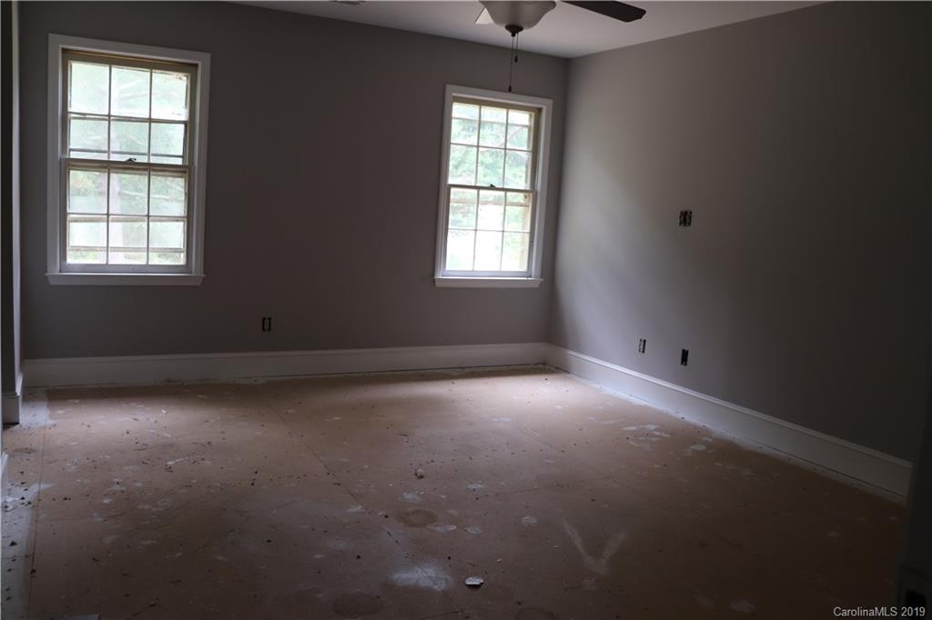 6520 Medlin Road Monroe, NC 28112 - Photo 17 of 22 an empty room with a window