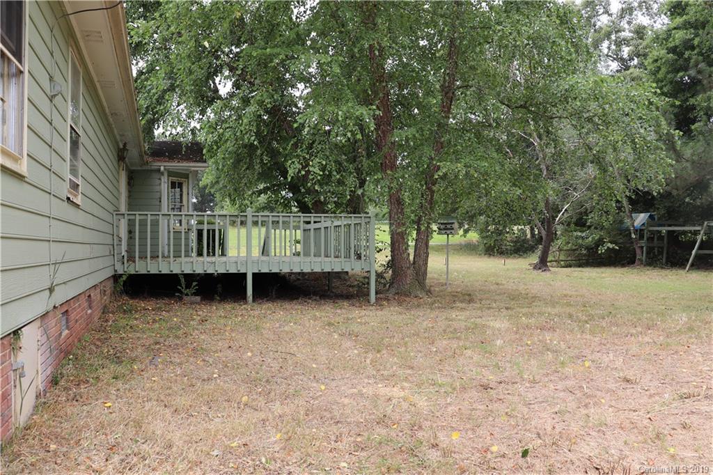 6520 Medlin Road Monroe, NC 28112 - Photo 3 of 22 a view of a house with a yard