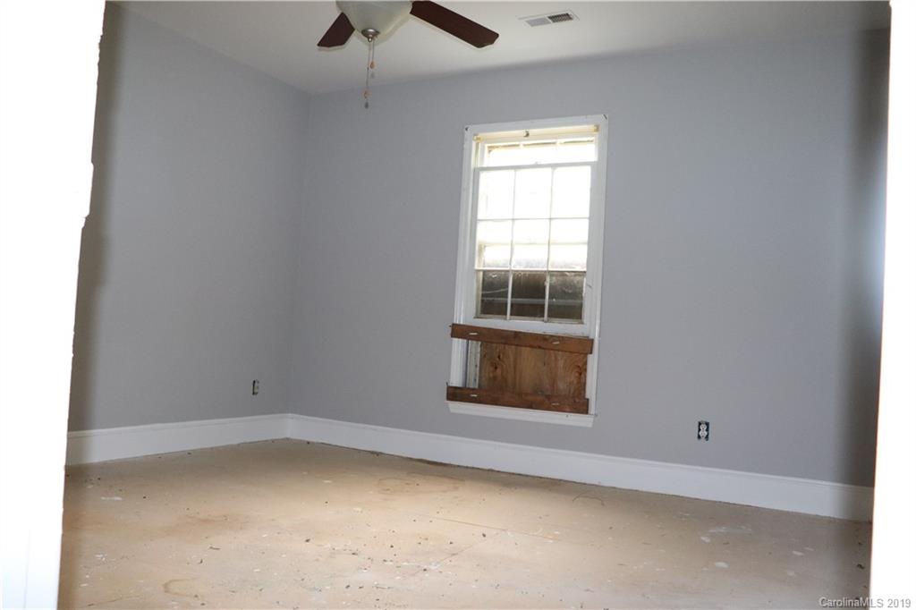 6520 Medlin Road Monroe, NC 28112 - Photo 21 of 22 an empty room with a window