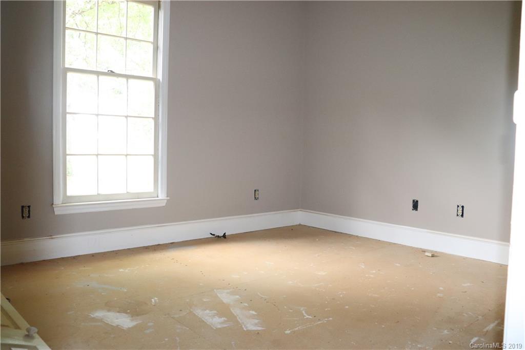 6520 Medlin Road Monroe, NC 28112 - Photo 22 of 22 an empty room with a window