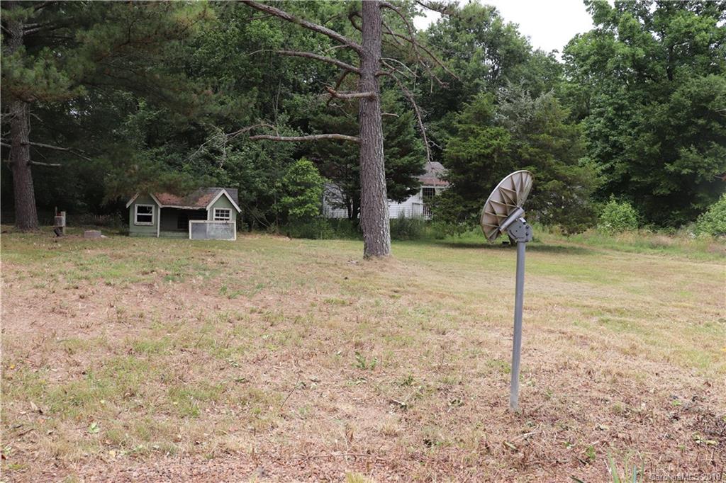 6520 Medlin Road Monroe, NC 28112 - Photo 4 of 22 a backyard of a house with lots of green space