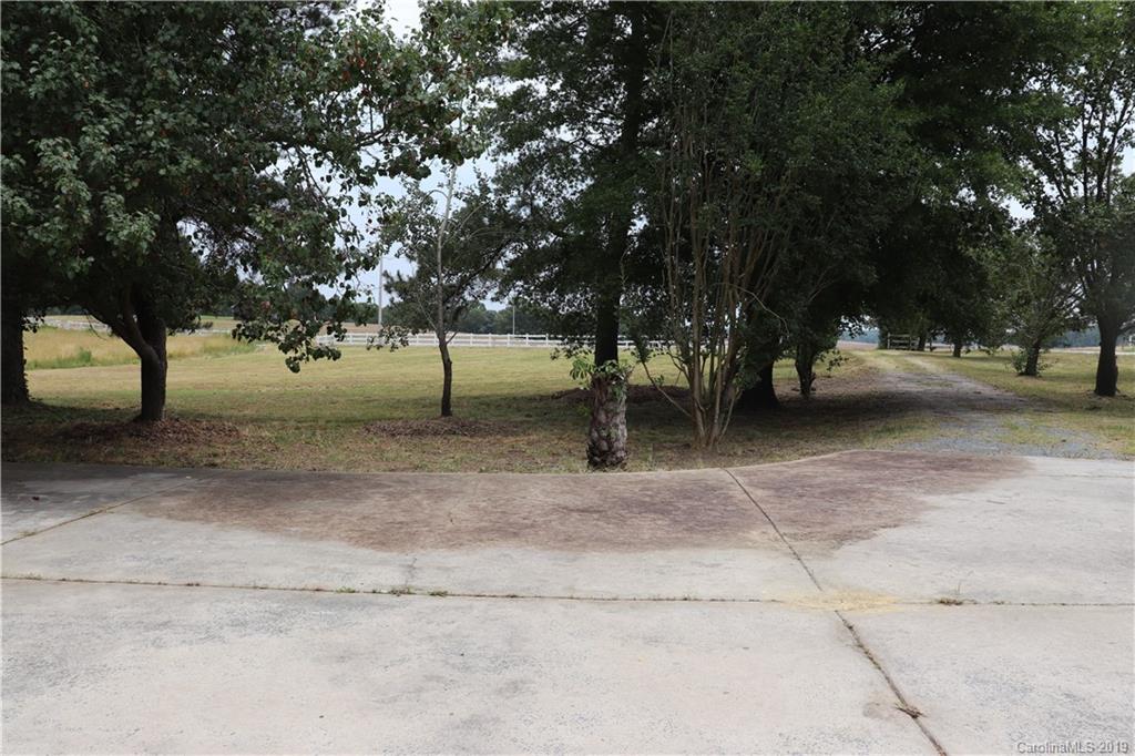 6520 Medlin Road Monroe, NC 28112 - Photo 6 of 22 a view of backyard with green space