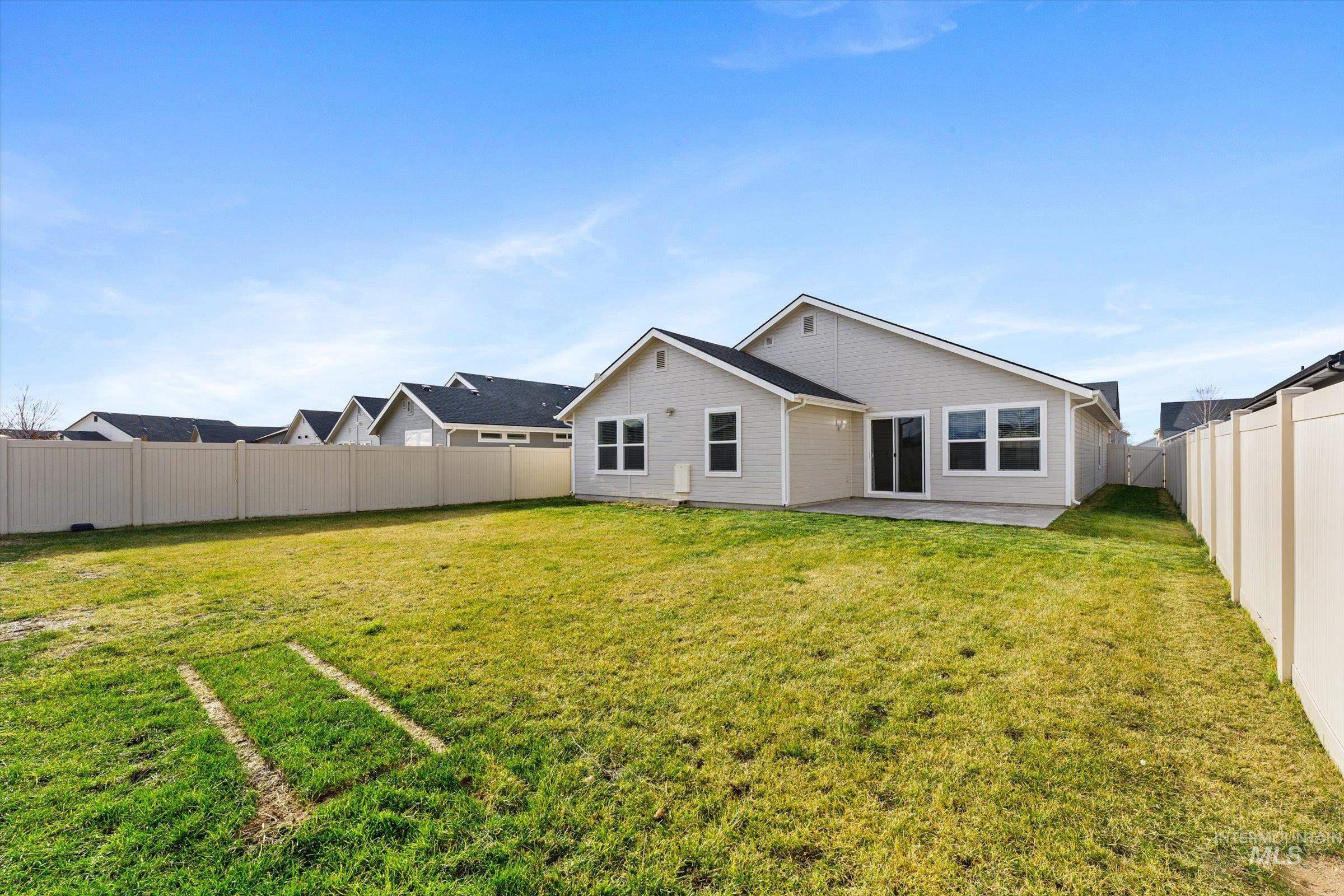 17798 Goose Ridge Avenue Nampa, ID 83687 - Photo 24 of 31 Back of house featuring a patio and a fenced backyard