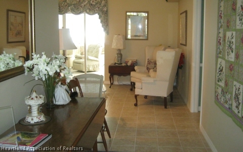 4570 Pebble Lane Sebring, FL 33872 - Photo 16 of 19 a living room with furniture flowerpot and wooden floor