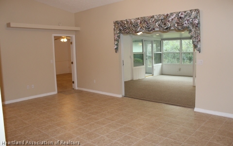 4570 Pebble Lane Sebring, FL 33872 - Photo 4 of 19 a living room with a large window