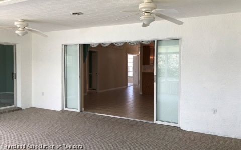 4570 Pebble Lane Sebring, FL 33872 - Photo 5 of 19 a view of gallery with wooden floor