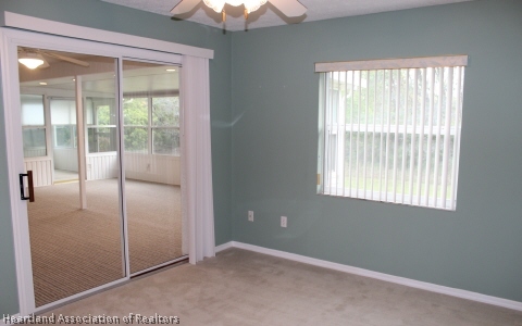 4570 Pebble Lane Sebring, FL 33872 - Photo 8 of 19 an empty room with windows