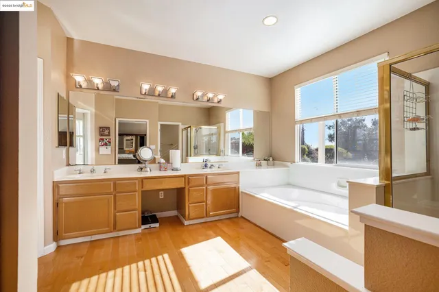 a bedroom with furniture and a flat screen tv