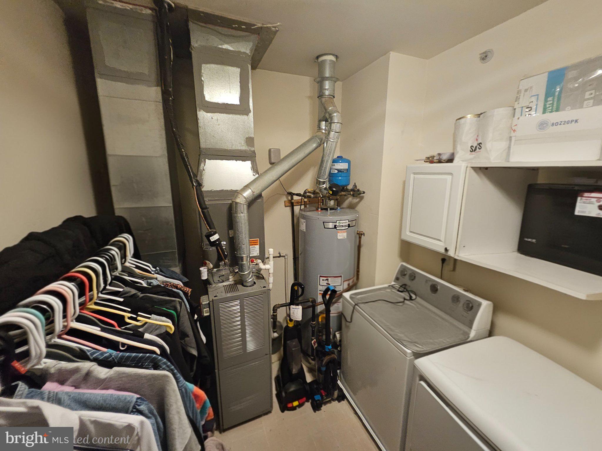 83 Kyle Way Ewing, NJ 08628 - Photo 20 of 36 Efficient utility space with laundry setup.