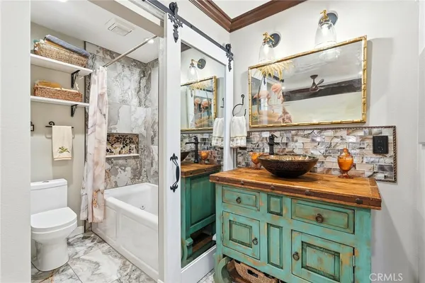 a bathroom with a bathtub and a toilet