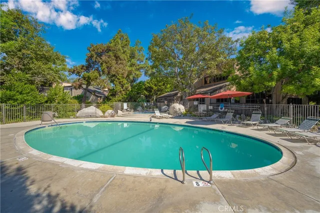 a backyard of a house with yard and outdoor seating