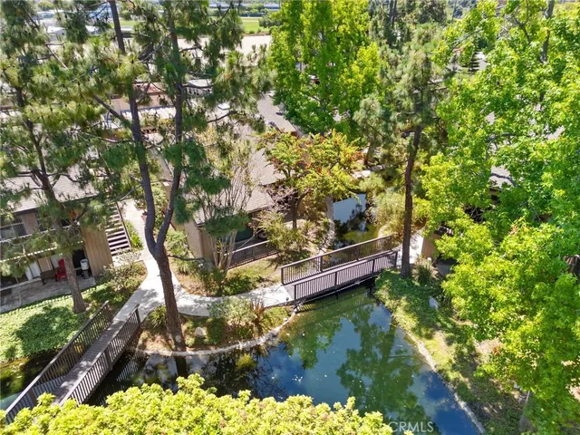 an aerial view of a house with a yard and garden