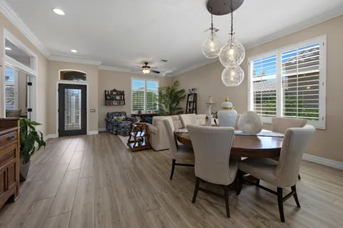 a kitchen with stainless steel appliances granite countertop a sink refrigerator and microwave