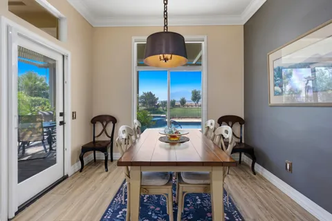 a bathroom with a granite countertop sink a large mirror and a window