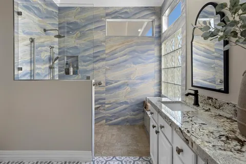 a view of a park with a garden and swimming pool