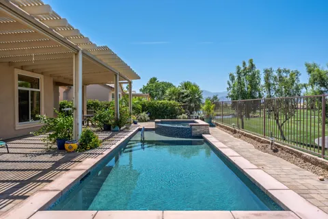 a view of an outdoor dining space with furniture and wooden floor