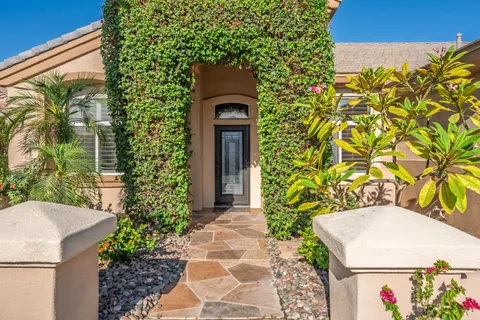 a view of a dining room with furniture wooden floor and chandelier