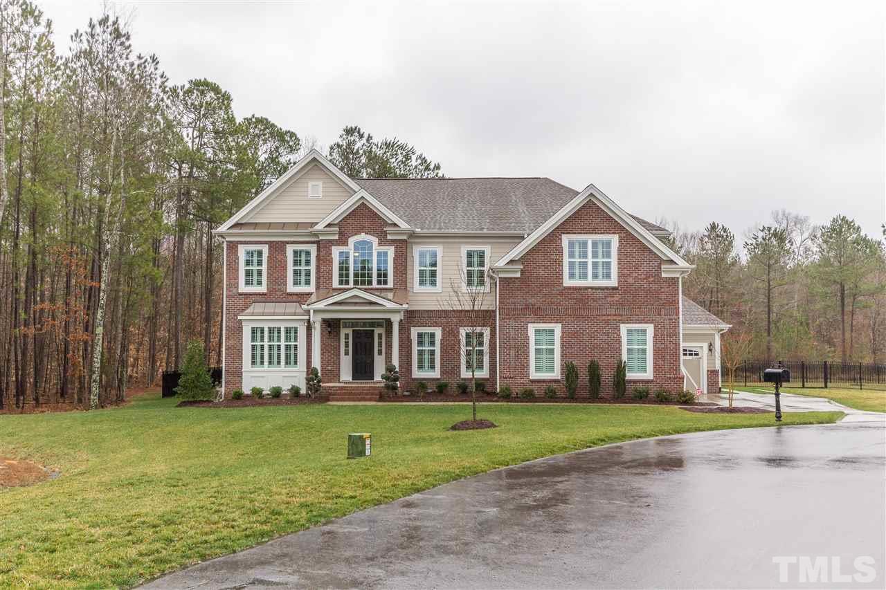 4600 Fielding Drive Raleigh, NC 27606 - Photo 2 of 25 a front view of a house with a garden and trees