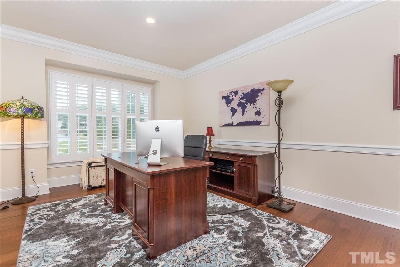 4600 Fielding Drive Raleigh, NC 27606 - Photo 12 of 25 a living room with a stove and a rug