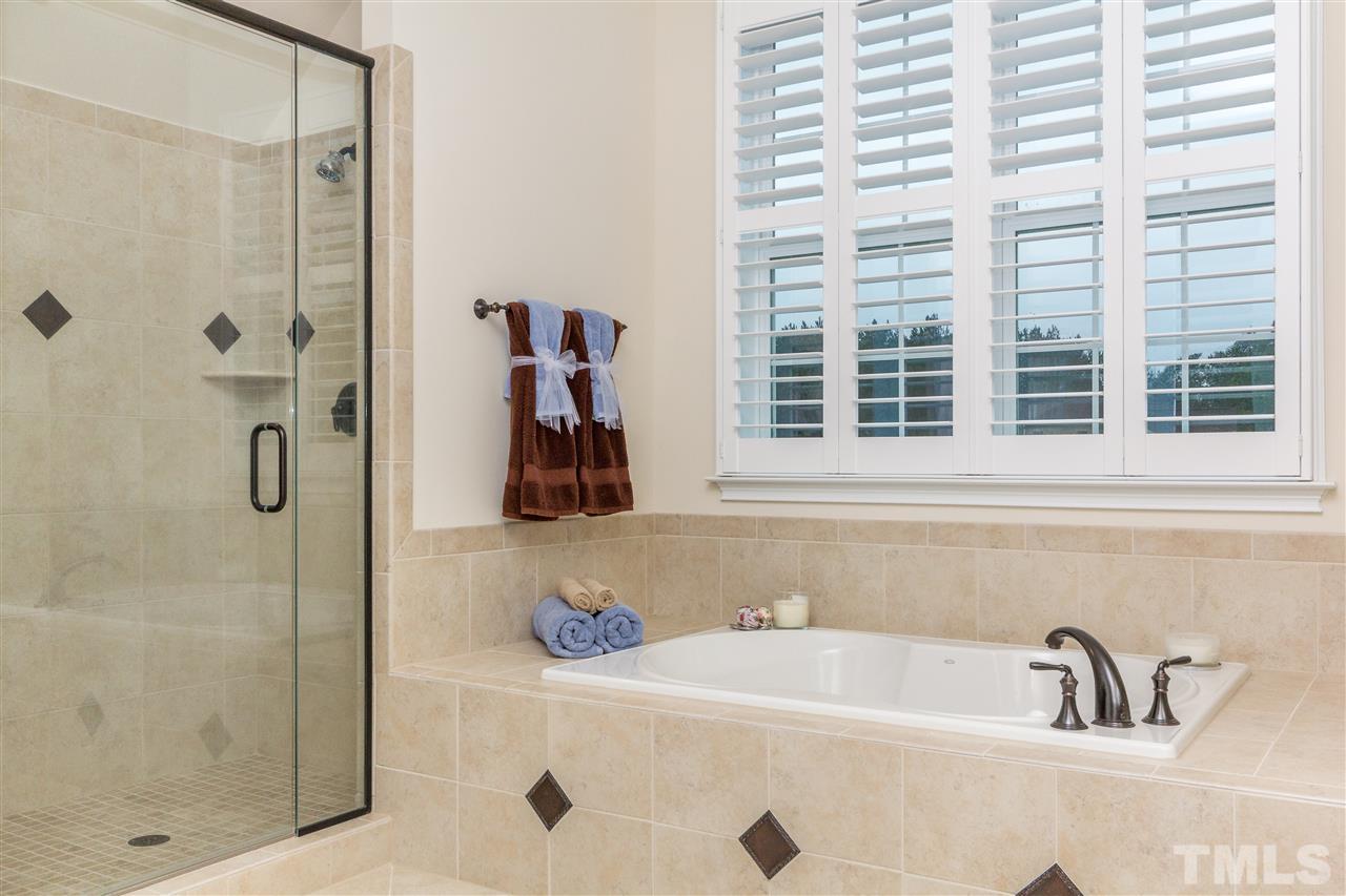 4600 Fielding Drive Raleigh, NC 27606 - Photo 15 of 25 a bathroom with a tub and a sink