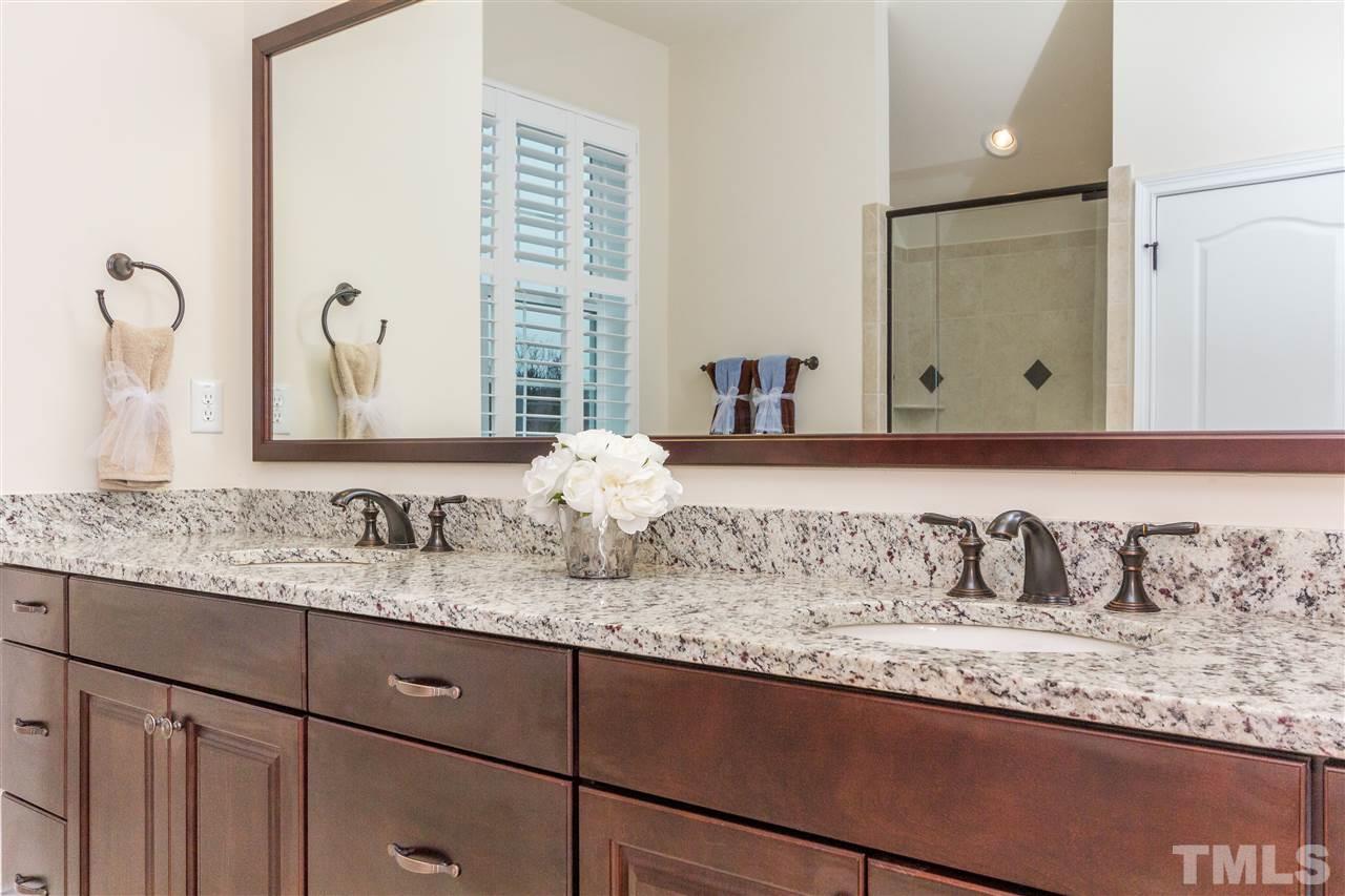4600 Fielding Drive Raleigh, NC 27606 - Photo 16 of 25 a bathroom with a granite countertop sink and a mirror